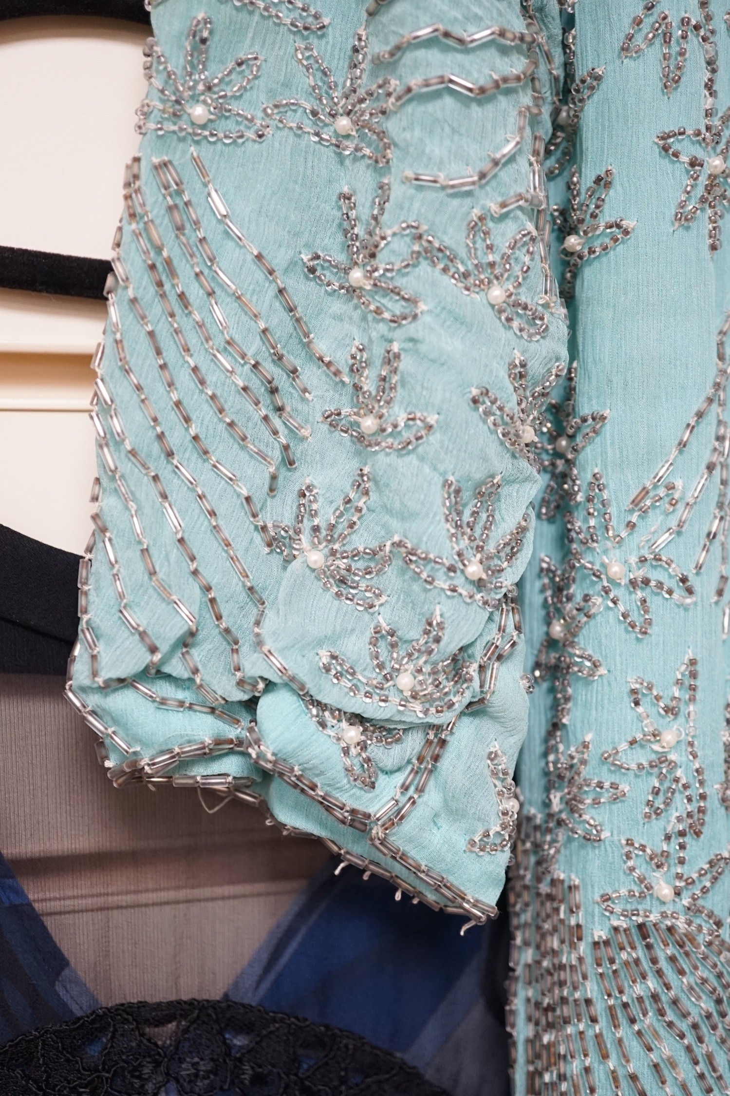 A 1940's turquoise chiffon evening dress and peacock designed shawl owned by Princess Sevilla Hercolani